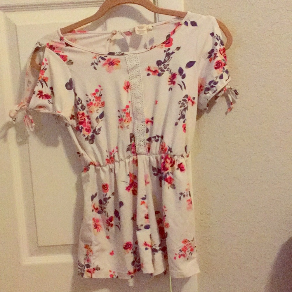 Cute white outfit with flowers on front.